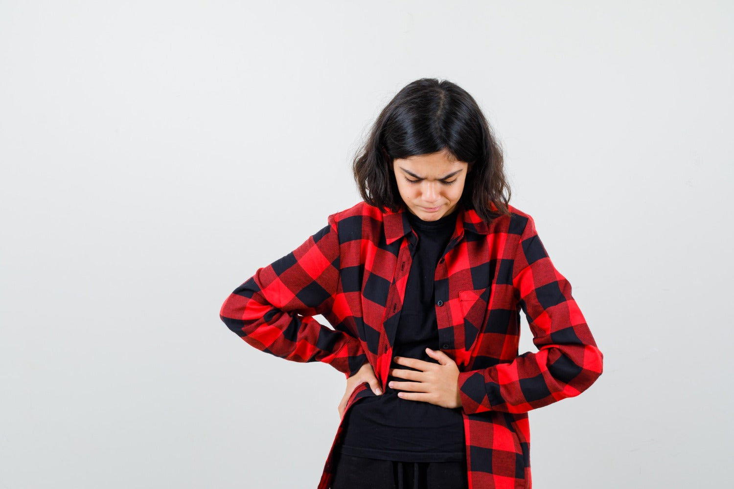 Girl suffering from stomach ache