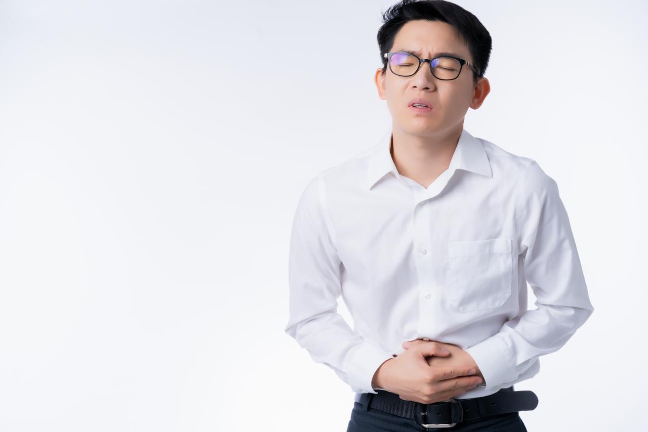 an man suffering from constipation